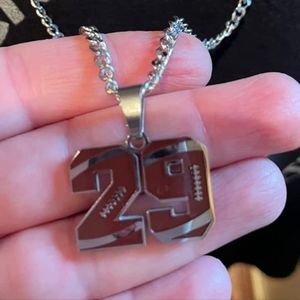 Stainless steel football number necklace. All numbers usually avail. Please ask.